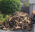 2 cord driveway drop of almond firewood in Sacramento CA.