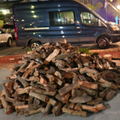 3/4 cord pile of almond firewood delivered in driveway in Sacramento CA.